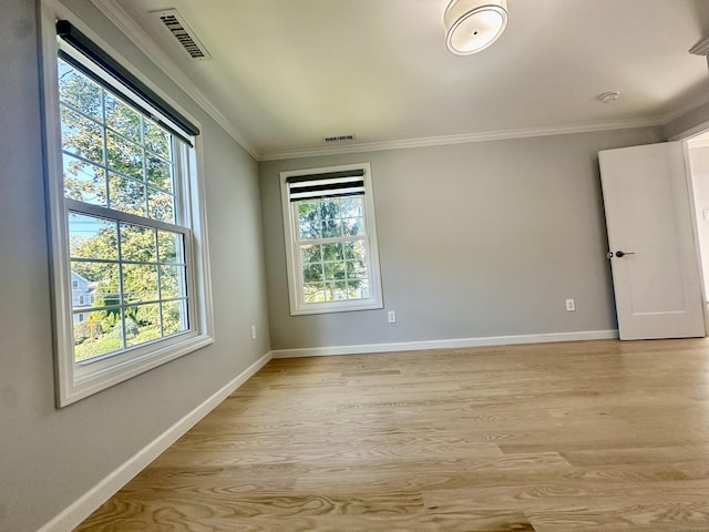 unfurnished room with light hardwood / wood-style floors and ornamental molding