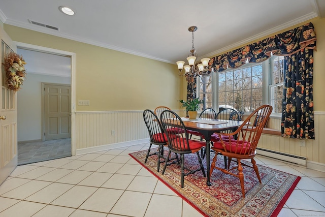 tiled dining space with a notable chandelier, ornamental molding, and baseboard heating