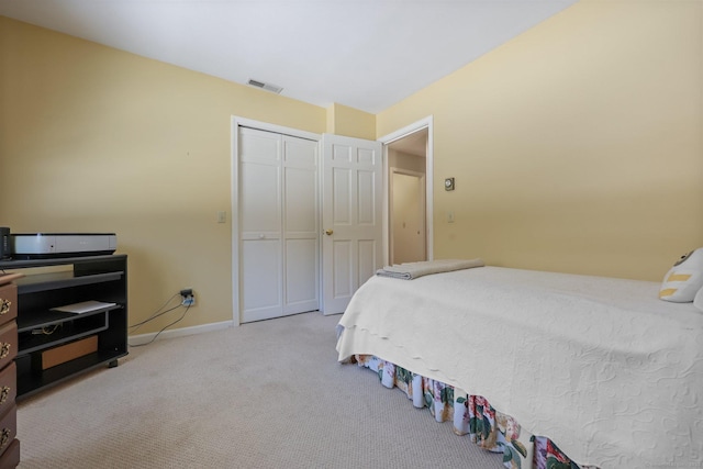 carpeted bedroom with a closet