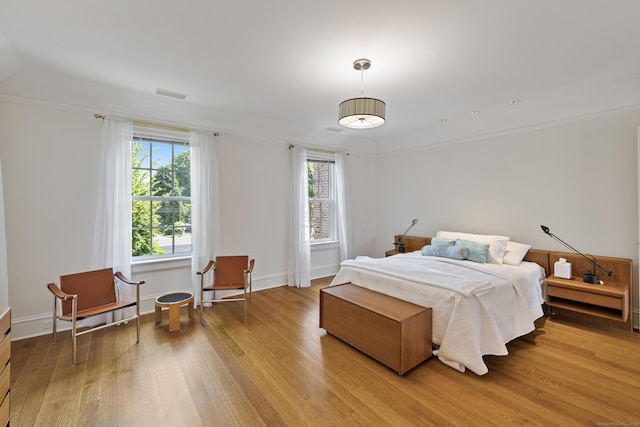 bedroom with light hardwood / wood-style flooring