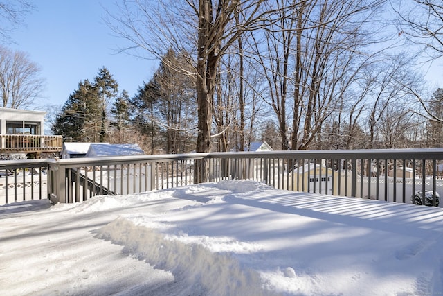 view of snow covered deck