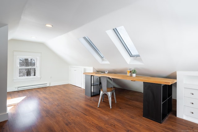 office area featuring a baseboard heating unit, vaulted ceiling, and dark hardwood / wood-style floors