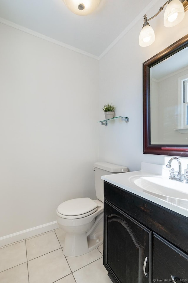 bathroom with tile patterned flooring, vanity, ornamental molding, and toilet