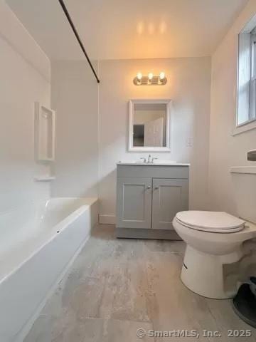 full bathroom with shower / bathtub combination, toilet, and vanity