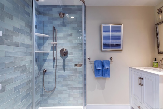 bathroom featuring vanity and an enclosed shower