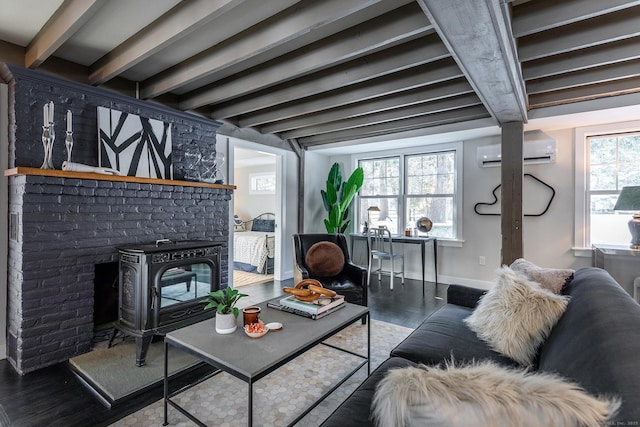 living room featuring beam ceiling, a wood stove, a wall mounted AC, and dark hardwood / wood-style flooring