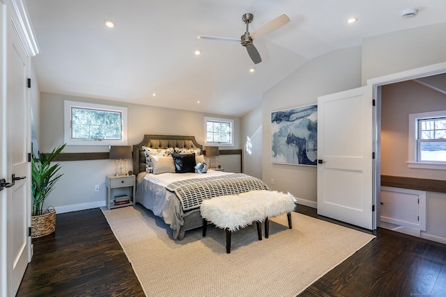 bedroom featuring dark wood-type flooring, ceiling fan, and vaulted ceiling