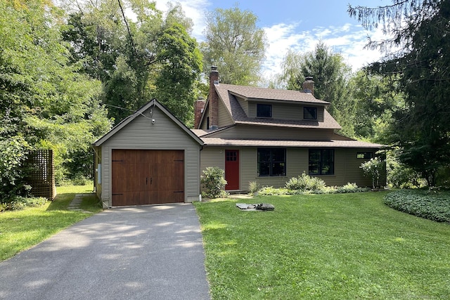 view of front of home with a garage and a front yard