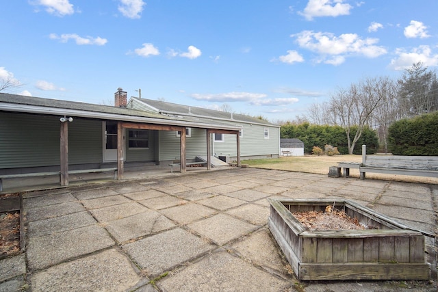 view of patio / terrace featuring a fire pit