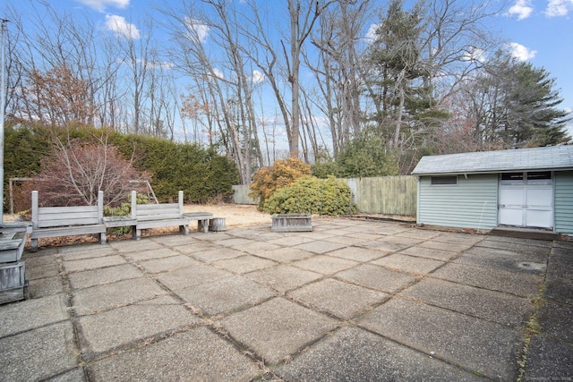 view of patio / terrace with a shed