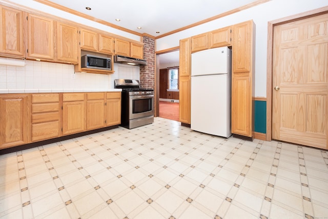 kitchen with tasteful backsplash, ornamental molding, stainless steel appliances, and tile countertops