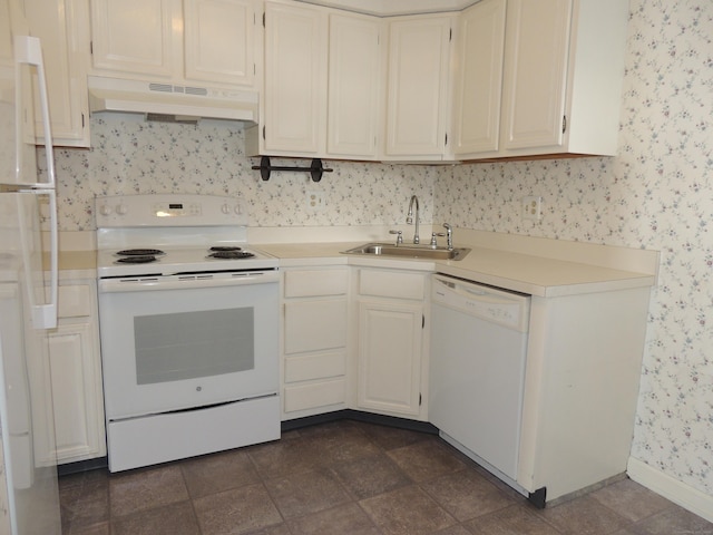 kitchen featuring sink and white appliances