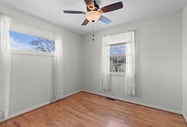 spare room with ceiling fan and light hardwood / wood-style floors