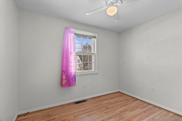 unfurnished room with light wood-type flooring and ceiling fan