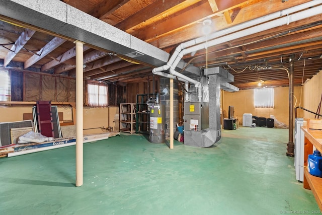 basement with heating unit and water heater