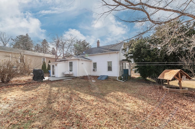 back of property featuring a patio