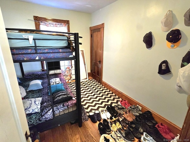 bedroom with hardwood / wood-style floors