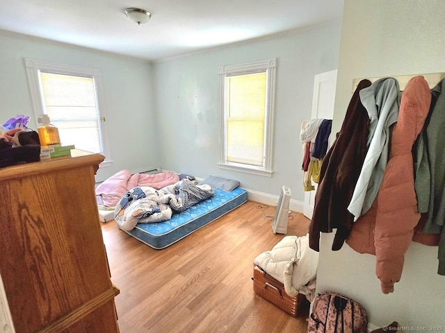 bedroom with light wood-type flooring