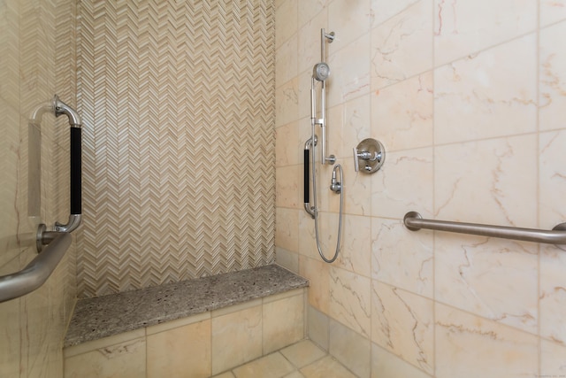 bathroom with a tile shower