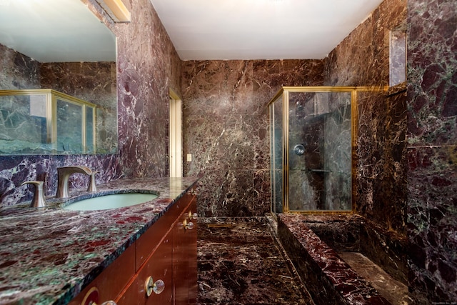 bathroom with tile walls, vanity, and separate shower and tub