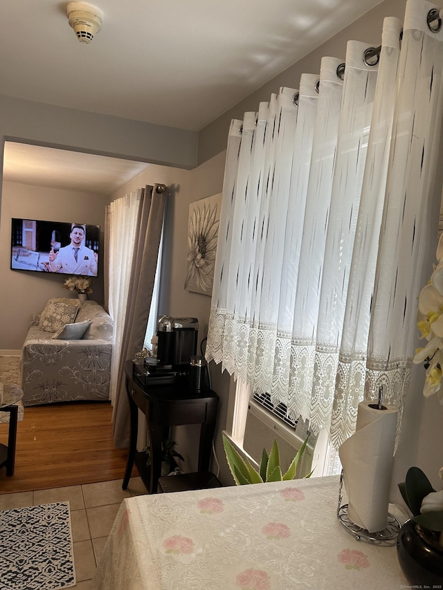 bedroom featuring light tile patterned floors