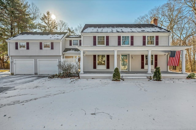 view of front of house featuring a garage and covered porch