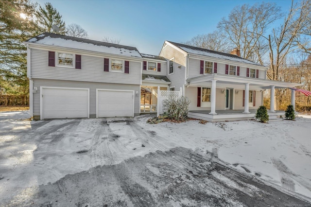 view of front of home featuring a garage and covered porch