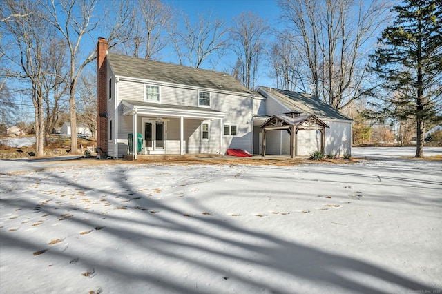 view of snow covered house