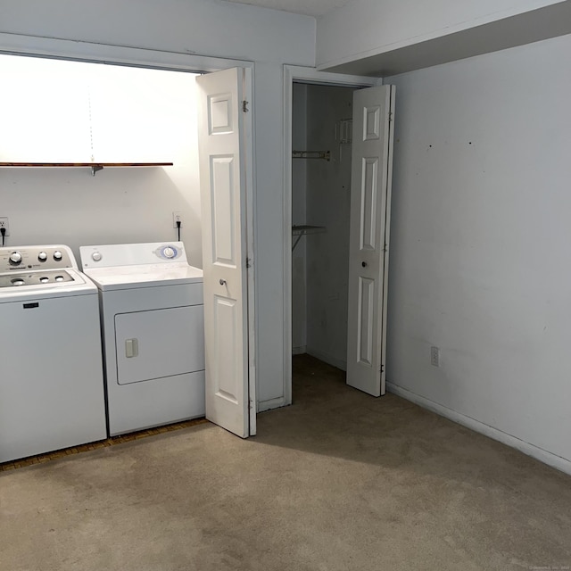 laundry area featuring washing machine and clothes dryer