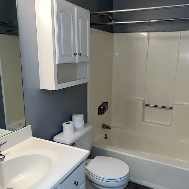 full bathroom featuring toilet, vanity, and shower / bathtub combination