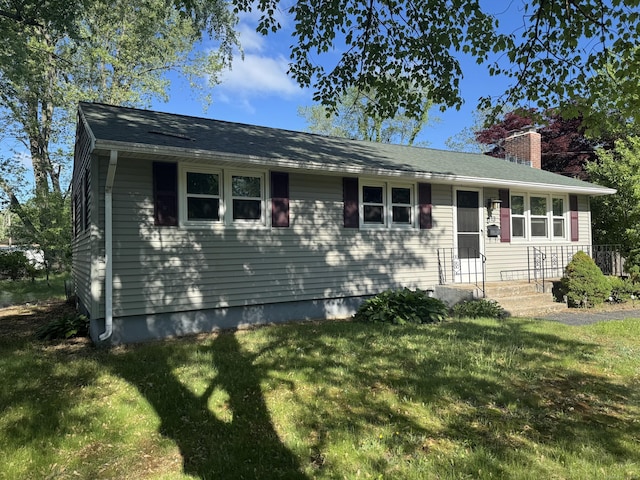 13 Lancer Dr, Enfield, CT 06082 - view of front of house with a front lawn and a chimney