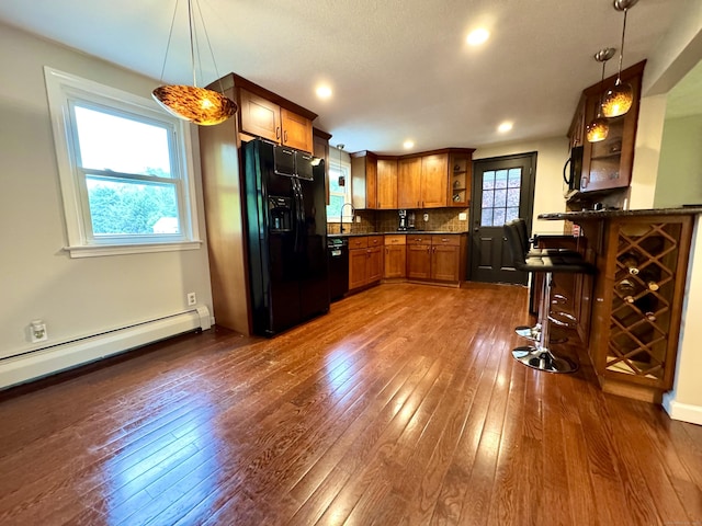 13 Lancer Dr, Enfield, CT 06082 - kitchen with black appliances, open shelves, dark wood-type flooring, brown cabinets, and backsplash