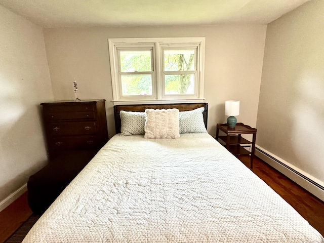 13 Lancer Dr, Enfield, CT 06082 - bedroom featuring baseboards, a baseboard radiator, and dark wood-style floors