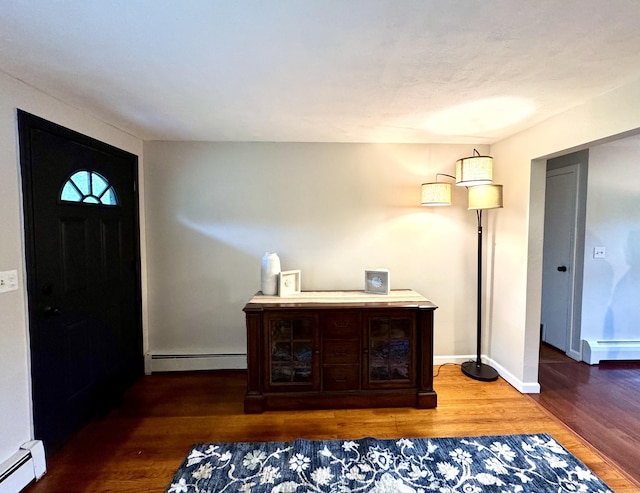 13 Lancer Dr, Enfield, CT 06082 - entrance foyer with a baseboard heating unit and wood finished floors