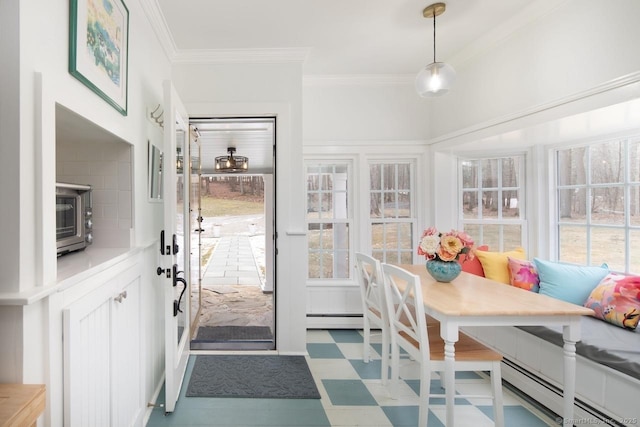 sunroom / solarium with a baseboard heating unit and breakfast area