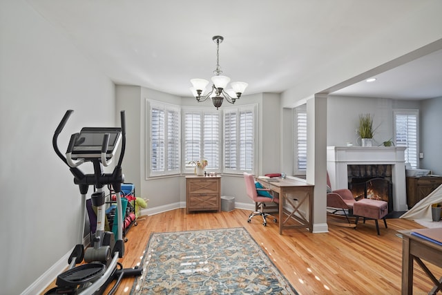 office space featuring hardwood / wood-style flooring and an inviting chandelier