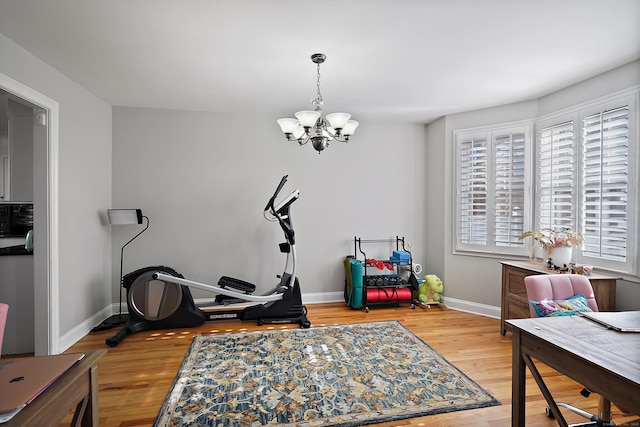 interior space featuring light hardwood / wood-style floors and a chandelier