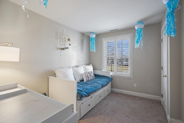 bedroom featuring light carpet