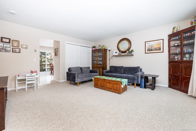 living room with light colored carpet