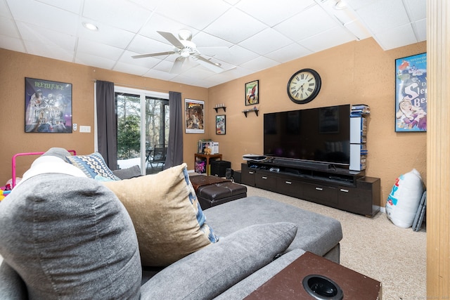 living room featuring ceiling fan, a paneled ceiling, and carpet floors