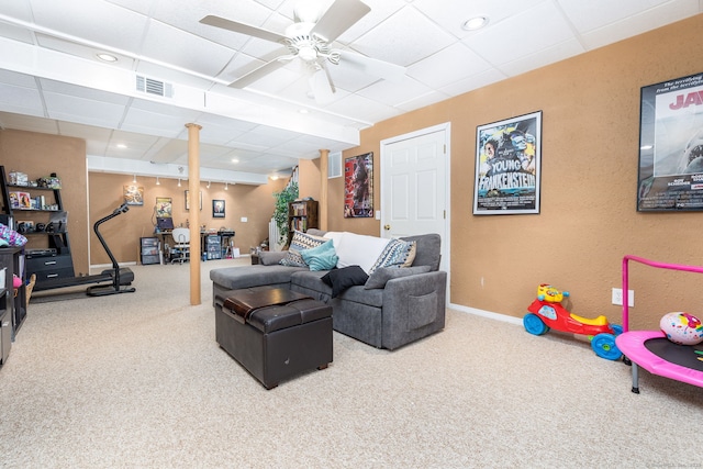 carpeted living room with ceiling fan