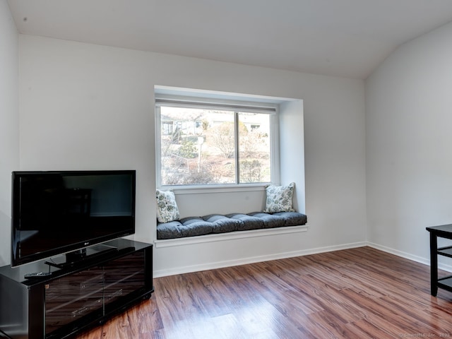 sitting room with wood finished floors and baseboards