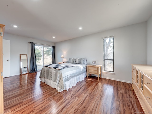 bedroom with recessed lighting, baseboards, and light wood-style floors