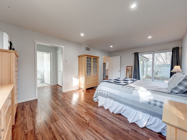 bedroom featuring visible vents, access to outside, wood finished floors, recessed lighting, and baseboards