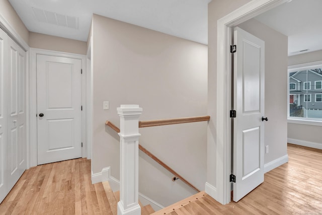 corridor with light wood-type flooring