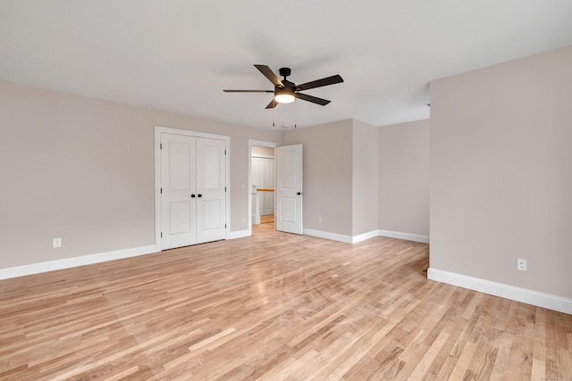 unfurnished bedroom with light wood-type flooring and ceiling fan