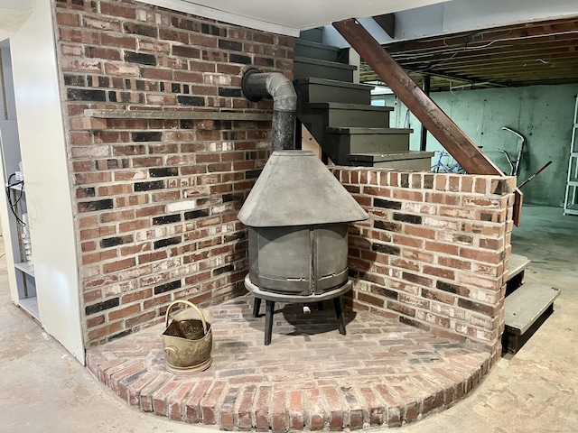 room details with a wood stove and concrete flooring