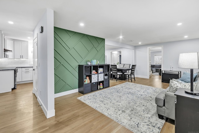 living room with light hardwood / wood-style flooring