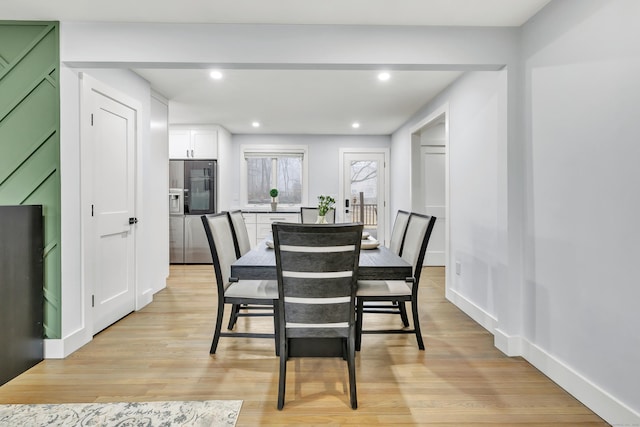 dining area with light wood-type flooring