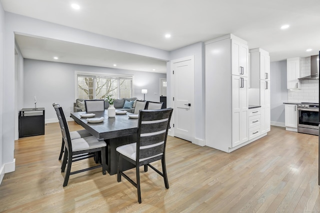 dining area featuring light wood-type flooring